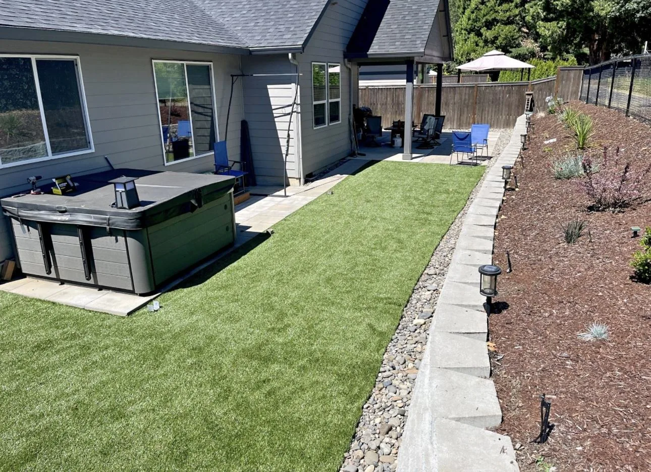 Synthetic grass installed in backyard by Actaeon