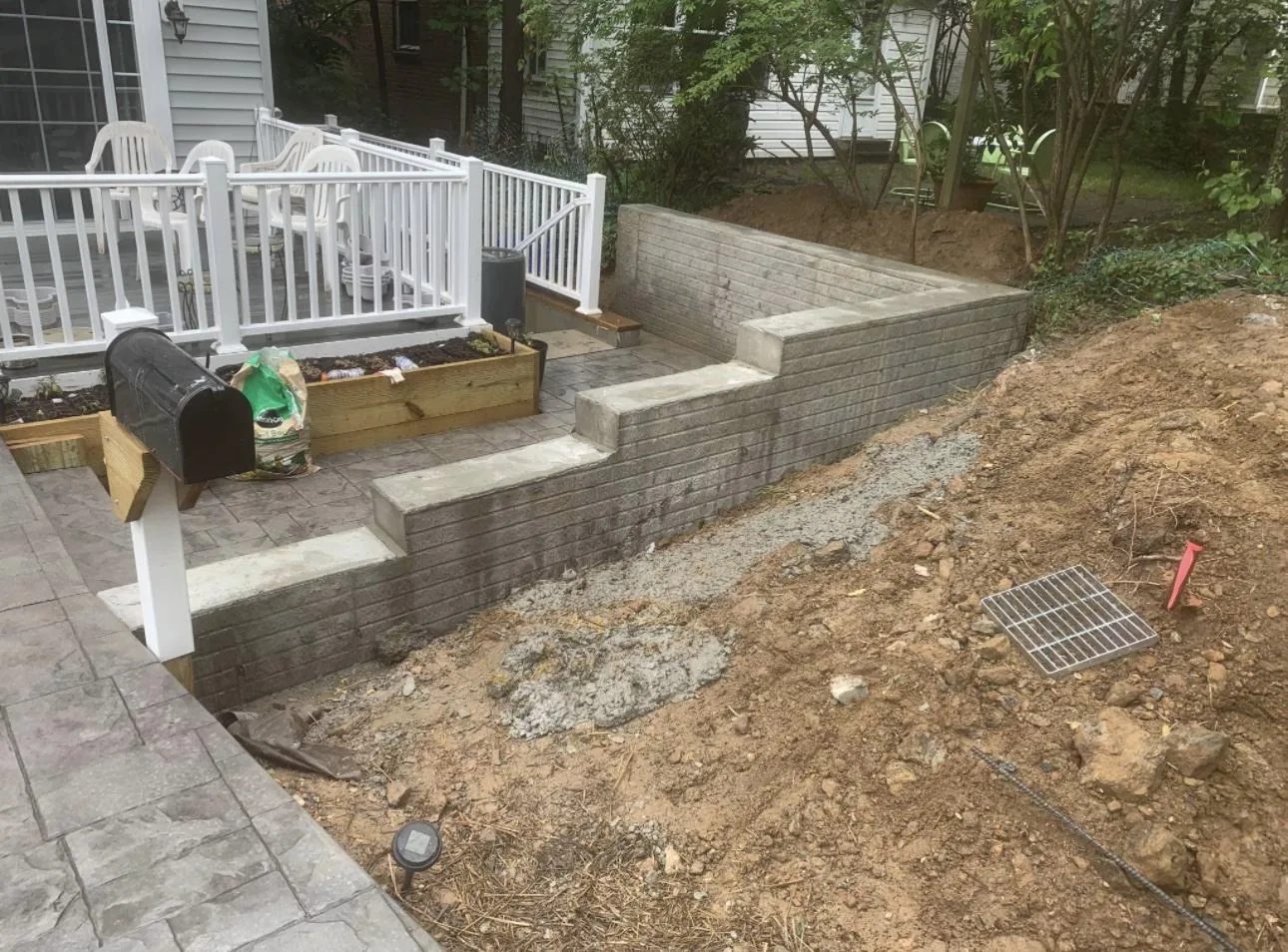 Completed retaining wall holding grade on Maryland property