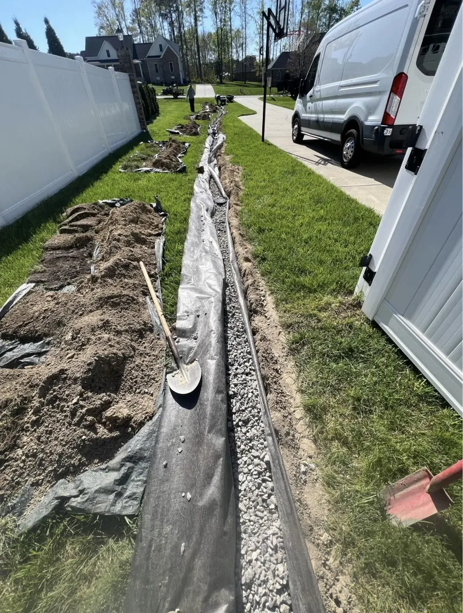 Yard drainage trench and pipe installation